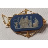 An antique gold Brooch with Wedgewood panel, 1904.