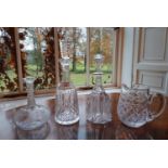 A quantity of Crystal Decanters and a Jug.