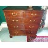 A Georgian Mahogany Chest of Drawers with original swan neck handles.