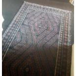 An Eastern Rug with allover decoration and multi borders. 240 x 127 cm.