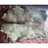 A Deer Hide along with a quantity of fabric.