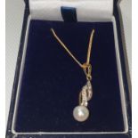 A 9ct gold and pearl Pendant and chain.