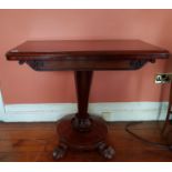 A Regency Mahogany Irish Foldover Card Table with hairy paw feet a moulded edge on a central