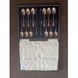 A really good cased set of twelve Silver Spoons and Tongs.