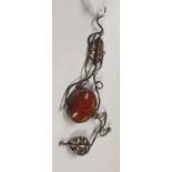 An antique amber style silver Pendant.