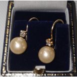 A pair of 14ct gold and pearl Earrings.