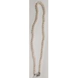 A good cultured pearl Necklet with a white gold and diamond clasp.