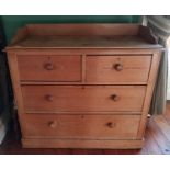 A 19th Century stripped Pine Chest of two long under two small drawers.