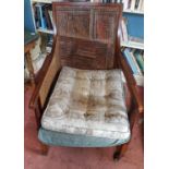 An Edwardian Mahogany Inlaid Armchair with cane work detail.