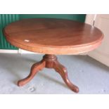 A 19th Century Mahogany circular Supper Table on a tripod base.