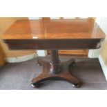 A Regency Rosewood Foldover Card Table on a platform base.