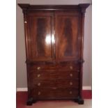 A really good Regency Mahogany Linen Press with a bank of drawers to the base and with a panelled