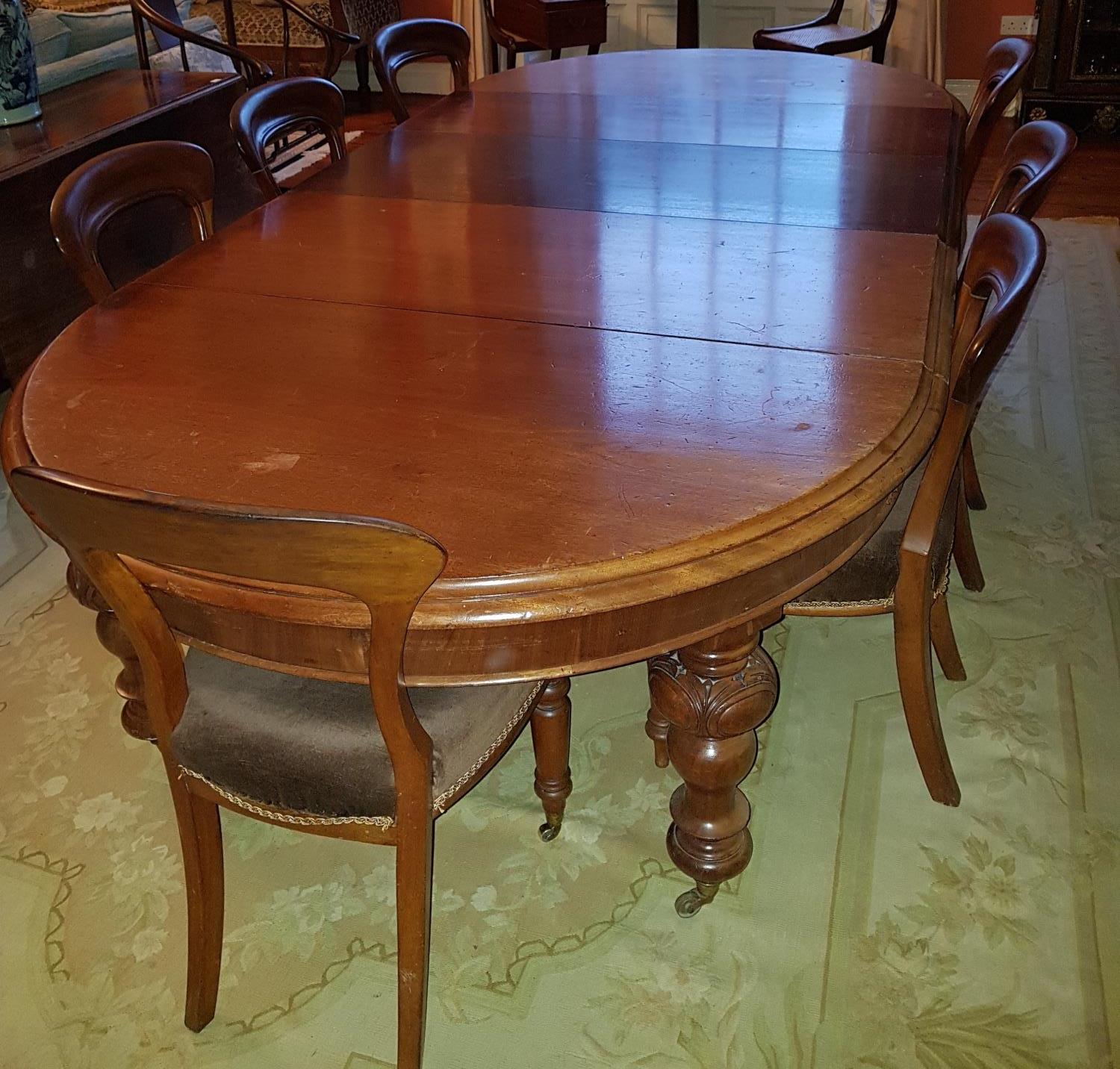 A good Victorian Mahogany D end Dining Table with turned carved supports and moulded edge.