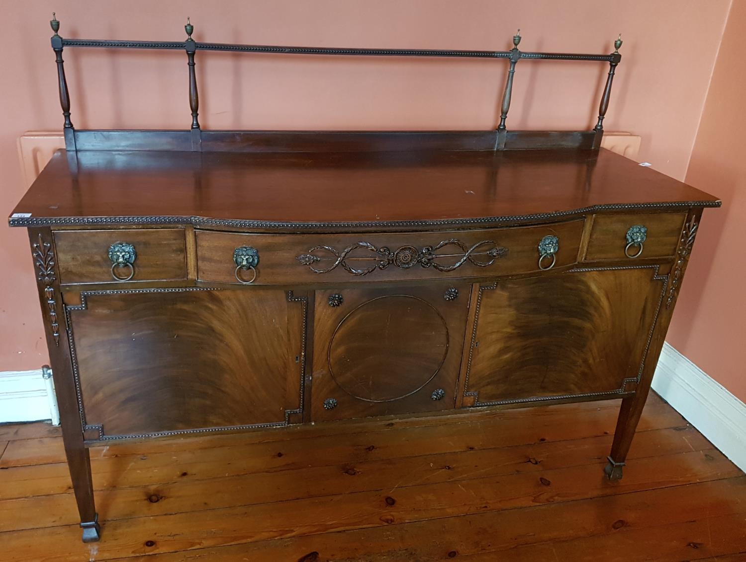 A really good late 19th early 20th Century Bow fronted Sideboard with a highly carved front and