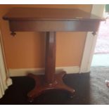 An early 19th Century Mahogany Side Table with side entry drawer and on a pedestal base.