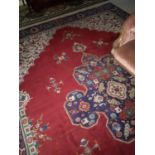 A large Multi Coloured Persian Rug with traditional medallion design. 380 x 274.