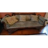 An Irish Regency roll arm Couch with gargoyle supports on hairy paw feet. Circa 1820.