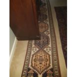 A really good Persian Runner with cross door design. 380 cms long.