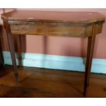 A Regency Mahogany Foldover Card Table with square inlaid tapered supports and baized interior.