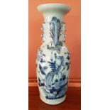 A large Oriental Vase with duck egg ground and birds of paradise decoration. 57 cms high.