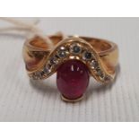 An 18ct Gold Ruby and Diamond Ring.