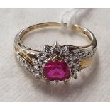 A 10ct gold, diamond and ruby cluster Ring.