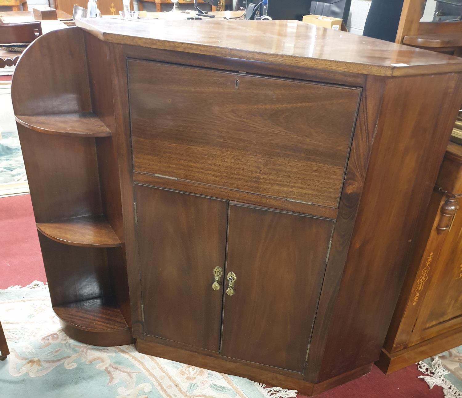 A 20th Century Mahogany Corner Cabinet.