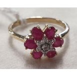 A 9ct Gold, Diamond and Ruby cluster Ring.