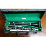 A Couesnon of Paris Clarinet with a McCullagh trade label on case along with a child's violin and