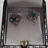 A pair of 18ct gold and emerald set stud Earrings.