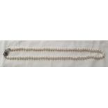 A good cultured pearl Necklet with a white gold and diamond clasp.