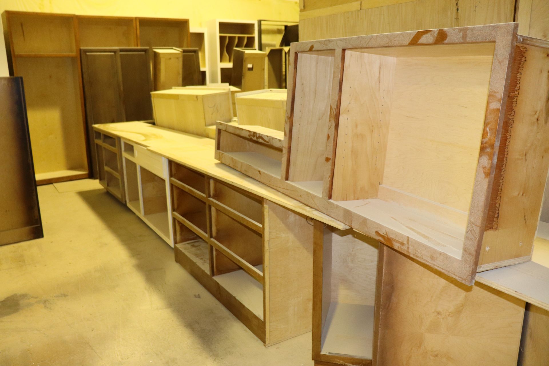 Contents of room: cabinets, hoods, work tables, trim, and bases