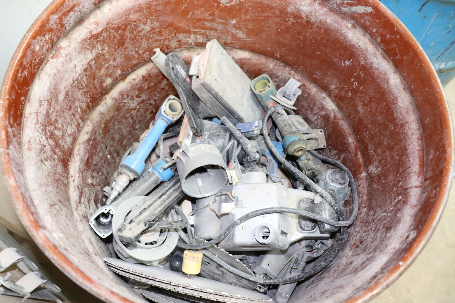 Two barrels with miscellaneous tools to be repaired