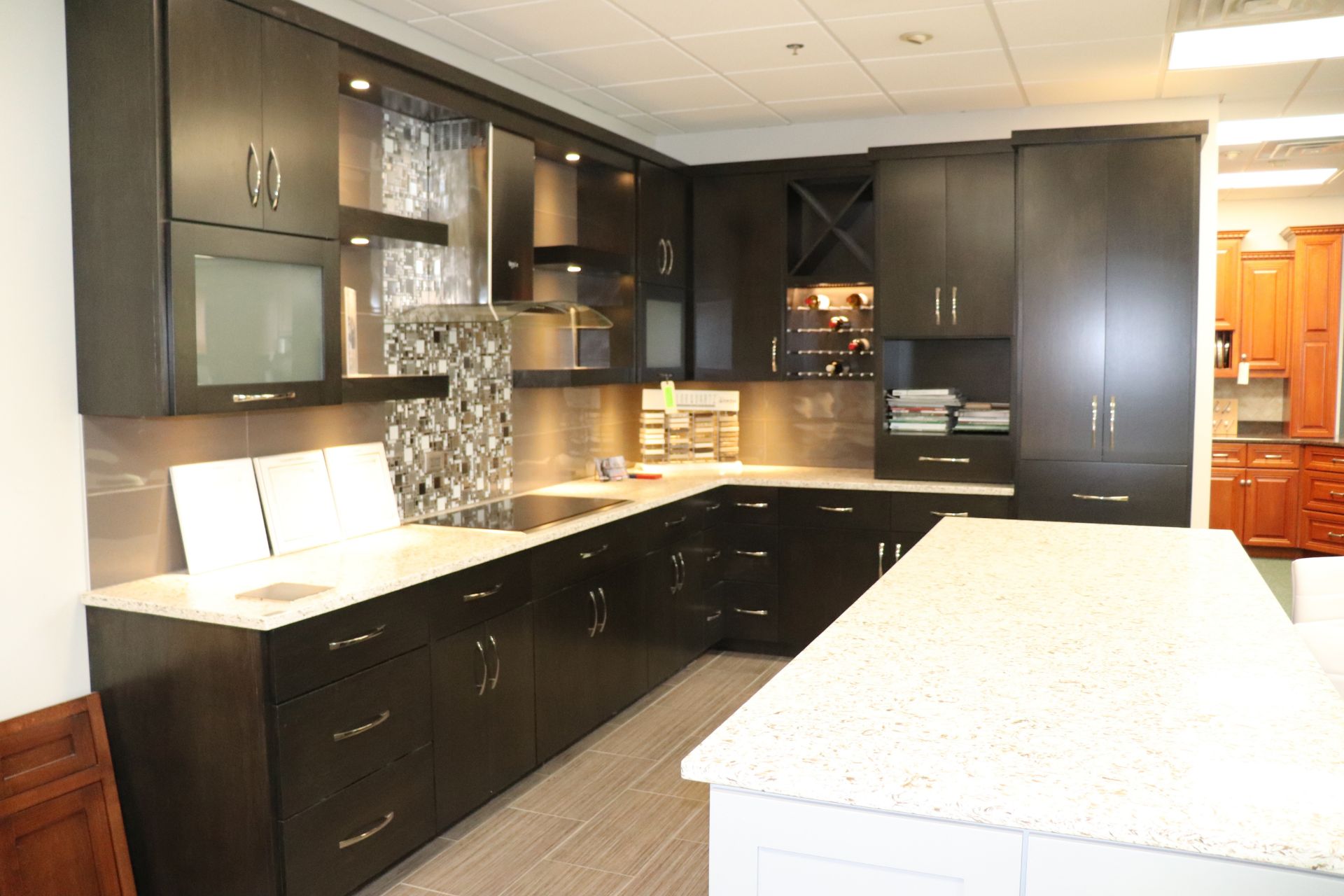 Showroom kitchen with Wolf electric range (top only) and Whirlpool exhaust hood