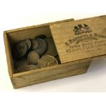 Coins in a wooden Box