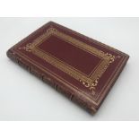 A RED LEATHER HARDBACK BOOK DEL COSTUME VENEZIANO 1831