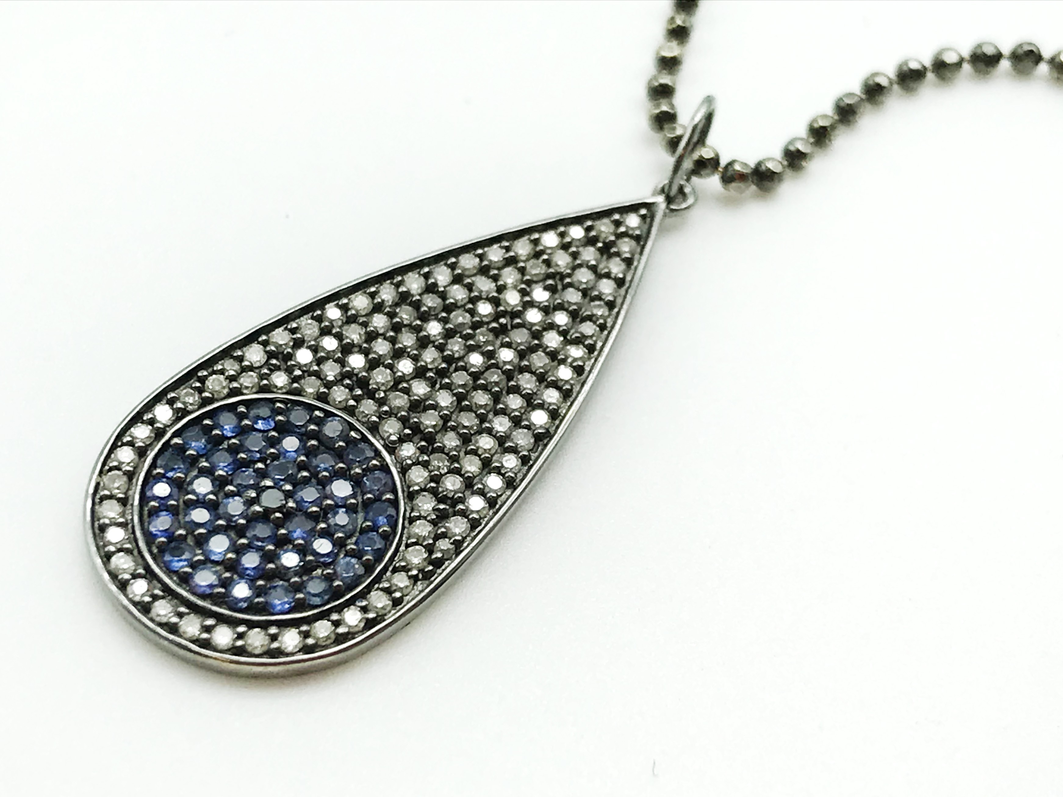 14 CARAT GOLD DIAMOND AND BLUE SAPPHIRE PENDANT AND CHAIN