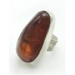 LARGE OVAL BALTIC AMBER STONE SET IN HANDMADE SILVER RING