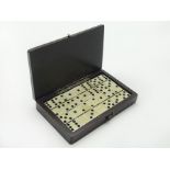 CASED MINIATURE WOODEN DOMINOES