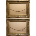 A Pair of Ornate 19th Gilt Swept Frames. Rebate measures 51cm x 76cm.