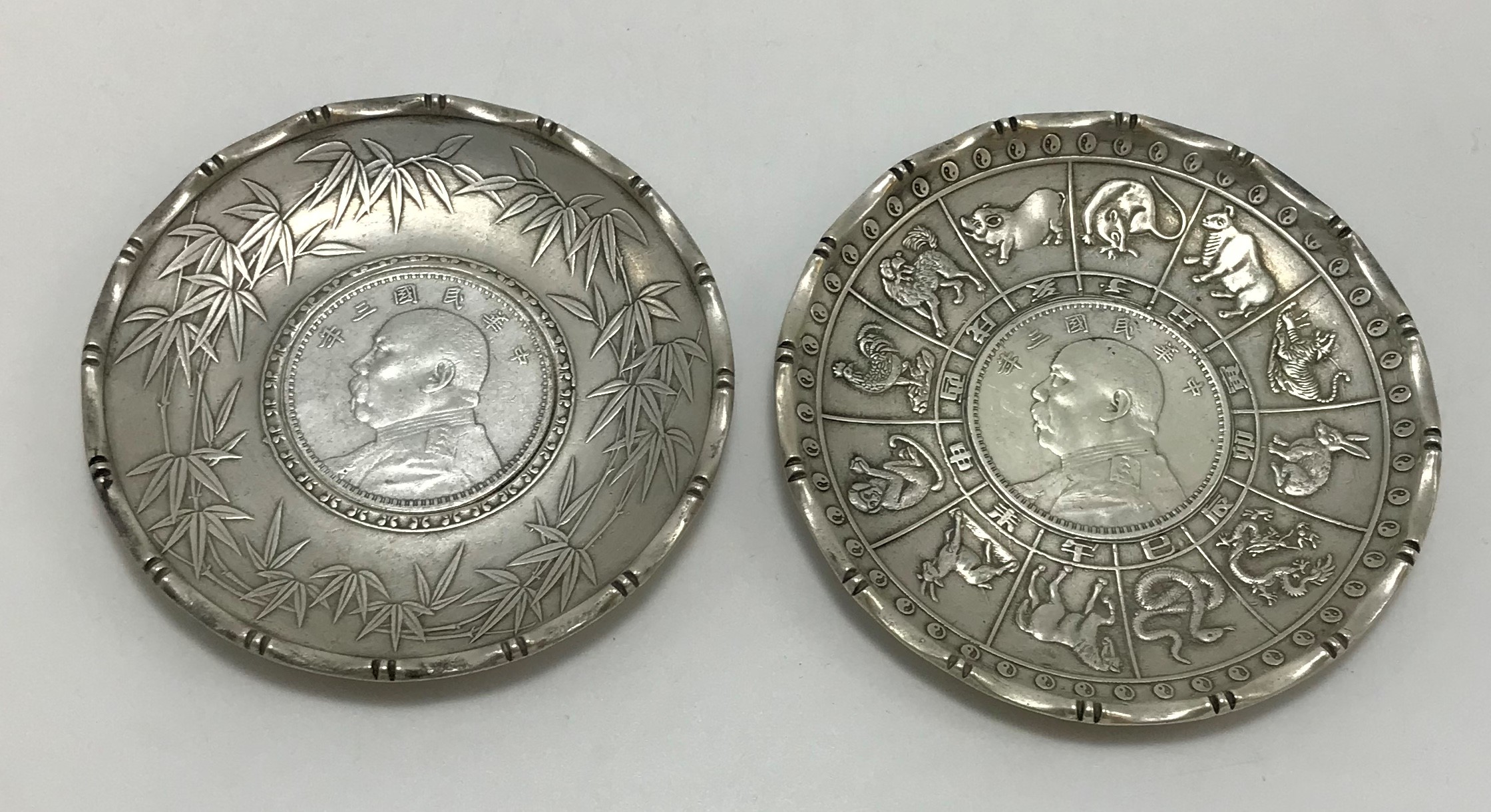 TWO CHINESE SOUVENIR SILVER COIN DISHES