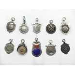 DARTS RELATED TEN HALLMARKED SILVER FOBS AND PENDANTS