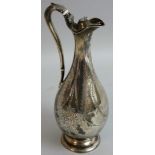 A Victorian silver baluster wine ewer, by Martin & Hall, Sheffield 1868, with floral engraved