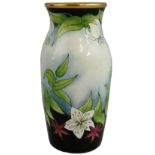 A Moorcroft miniature enamel vase, decorated with flowers and gold trim, c.1999, initialled 'FW'