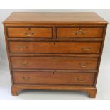 A 19th century oak chest of drawers, composed of two short over three long drawers with a mahogany
