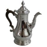 A George III silver baluster coffee pot, maker not traced, London 1765, of plain form with leaf