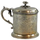 A Victorian silver mustard pot, London 1865, with floral engraved decoration, floral finial, no