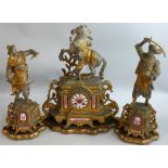 A 19th century French porcelain and spelter clock garniture, c. 1860/70, the central gilt and