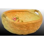A Royal Worcester blush ivory two-handled fruit bowl, of weaved basket form with painted floral