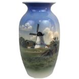 A Royal Copenhagen ovoid vase, printed in tones of blue with windmill and landscape motif, factory